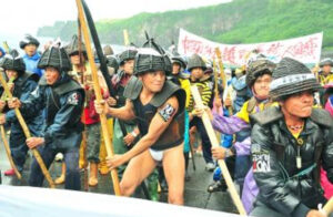 Indigenous people of Orchid Island protest against a nuclear waste dump site on their island
