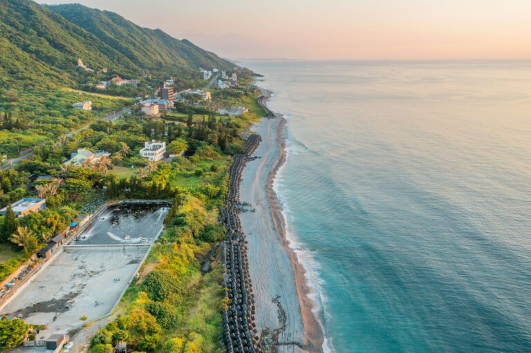 Scenic aerial view of Hualien's coastline in Taiwan, showcasing lush greenery and serene ocean waters.