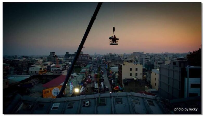 A crane lifts the body of a victim of Taiwan's earthquake February 7, 2016